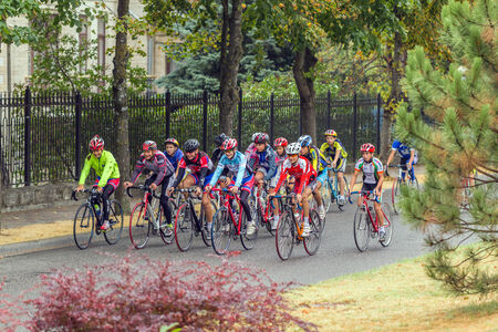 A group of cyclists on a city street.のeditorial素材