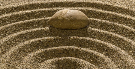 Stones and ring lines in the sand.