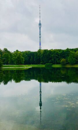 Reflection of the Ostankino TV tower in the pond of the Ostankino park Moscow Russiaの写真素材