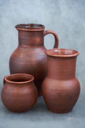 Clay jugs on a gray background. Rustic style.の写真素材