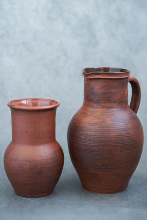 Clay jugs on a gray background. Close-up.の写真素材