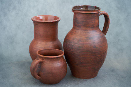 Clay jugs on a gray background, close-up.の写真素材