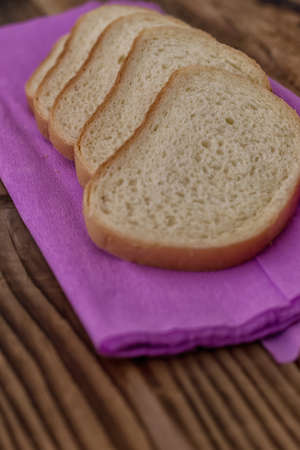 Domestic bread on a background woodの写真素材