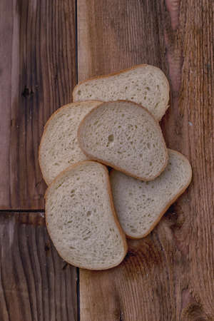 Domestic bread on a background wood