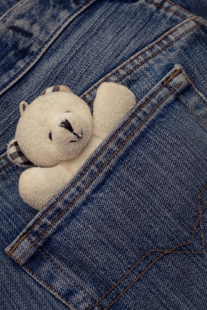 Pocket of jeans with child s  toyの写真素材