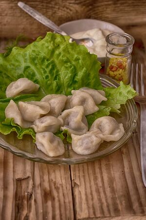Meat dumplings prepared with greeneryの写真素材