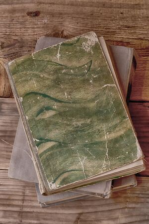 old books on a wooden backgroundの写真素材