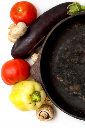 Mushrooms and fresh vegetables on the rusty panの写真素材