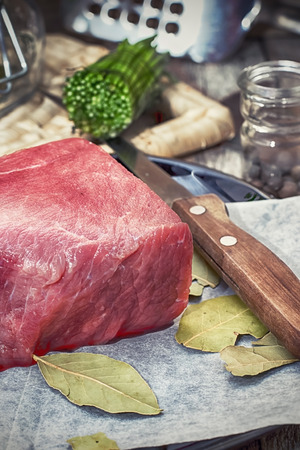slice of fresh,juicy beef on the tableの写真素材