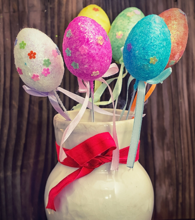 chicken eggs painted in different colorsの写真素材