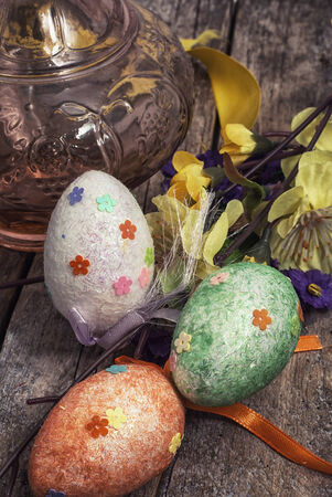 Easter composition with decorative eggs and flowersの写真素材