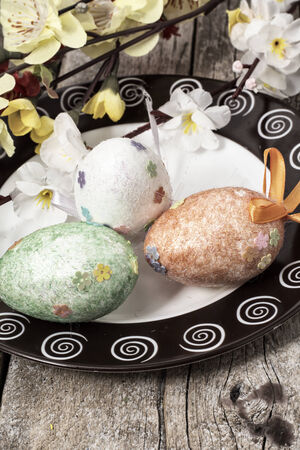 Easter composition with decorative eggs and flowersの写真素材