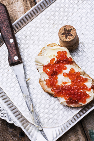 Sandwiches delicacies with red caviar,butter and breadの写真素材