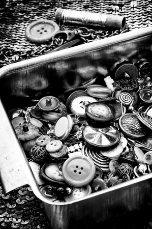 iron tray with buttons and sewing toolsの写真素材