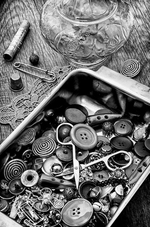 buttons and zipper on the background of sewing toolの写真素材