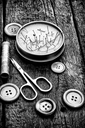 buttons and zipper on the background of sewing toolの写真素材