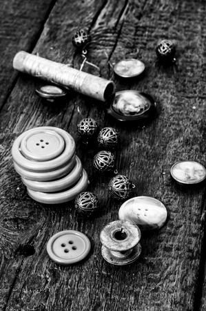 buttons and zipper on the background of sewing toolの写真素材