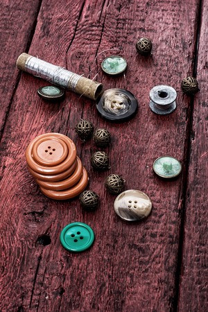 buttons and zipper on the background of sewing toolの写真素材