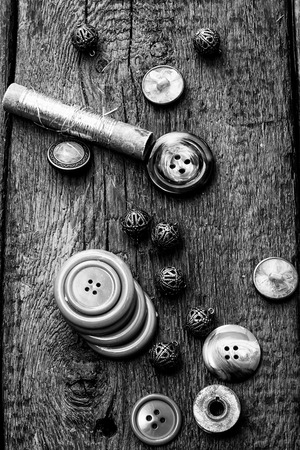 buttons and zipper on the background of sewing toolの写真素材