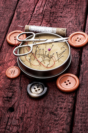 buttons and zipper on the background of sewing toolの写真素材