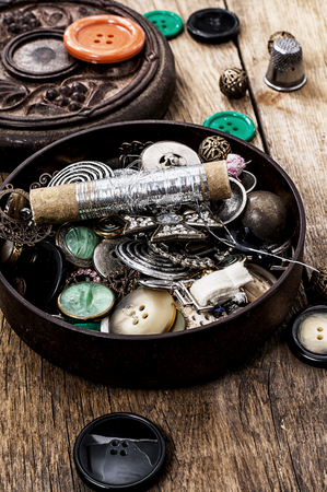 buttons and zipper on the background of sewing toolの写真素材