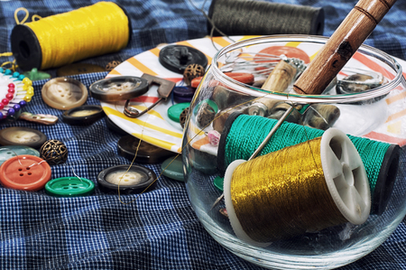 thread,button,crochet hook, and other sewing tools