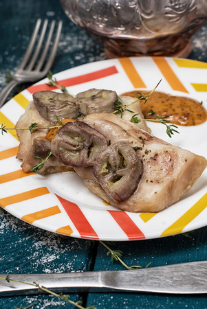 baked fish with banana and with sauceの写真素材
