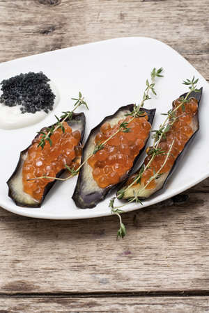 light snack from caviar and fresh eggplantsの写真素材