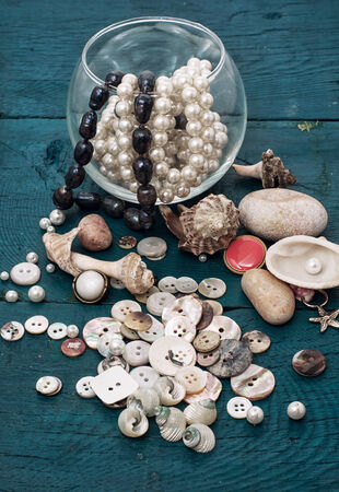 composition with seashells and sewing accessories and suppliesの写真素材