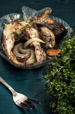 piece of fragrant roasted fish in sauce and spicesの写真素材