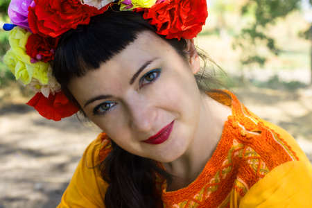 cute woman with a wreath of flowers on her head