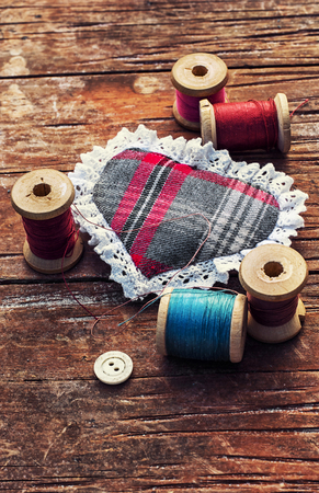 isalnita-heart with spools of thread and buttonsの写真素材