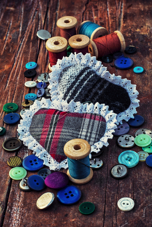 isalnita-heart with spools of thread and buttonsの写真素材