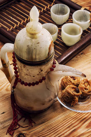 tea set and Oriental sweets in retro styleの写真素材