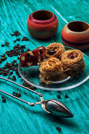 tea set and Oriental sweets in retro style