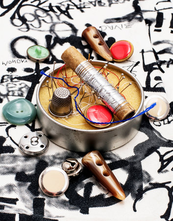 buttons and zipper on the background of sewing tool