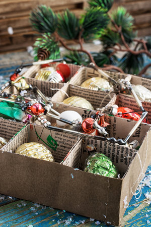 various outdated Christmas toys in a cardboard boxの写真素材