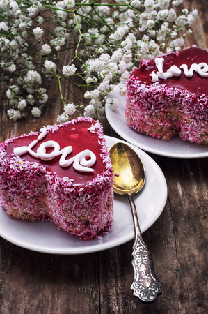 cake with fruit filling in the shape of heart with the inscription loveの写真素材