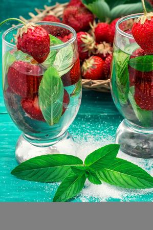 glass with drink of strawberries and mintの写真素材