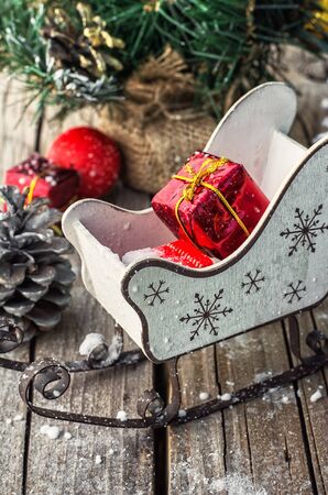 Christmas decorations on the background of the sleigh of Santa Claus .Photo tinted.の写真素材