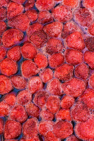 The process of making strawberry jam from fresh berriesの写真素材