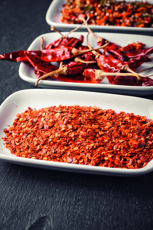 Assembly seasoning of pepper and hot spices in a porcelain bowlの写真素材