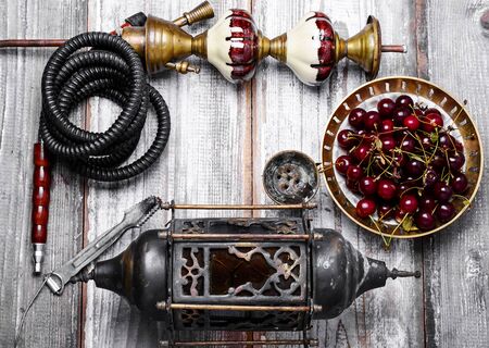 Details Eastern smoking hookah with berry cherryの写真素材