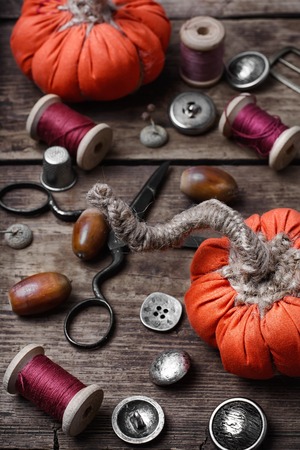 Sewing decorative pumpkins from fabric for autumn decorationsの写真素材
