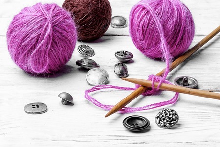 Kit knitting wool and knitting needles and buttonsの写真素材
