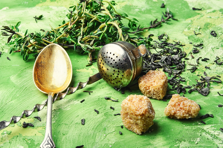 Dry tea leaf and fresh thyme for tea.の写真素材