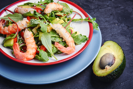vegetarian spring salad with large shrimp,avocado,and tomatoの写真素材