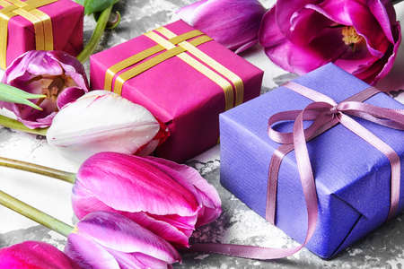 Bouquet of purple tulips and gift boxの写真素材