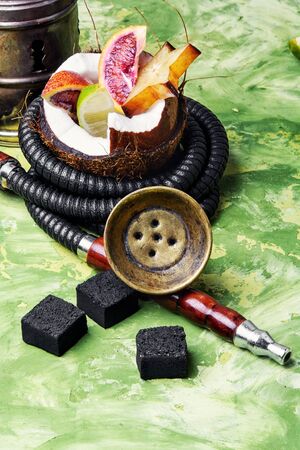 Smoking Shisha with the scent of coconut and lime