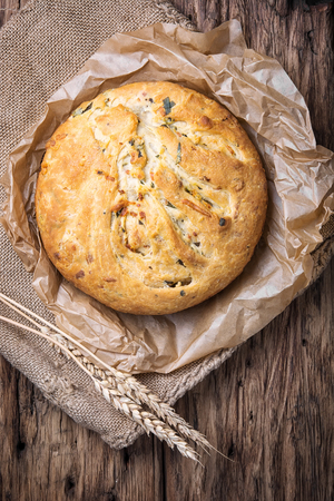Fragrant homemade baked bread in a rural style. Bread with herbsの写真素材